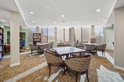 Bright and welcoming common area with bookshelves and seating