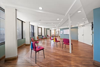 Bright activity room with spaced seating