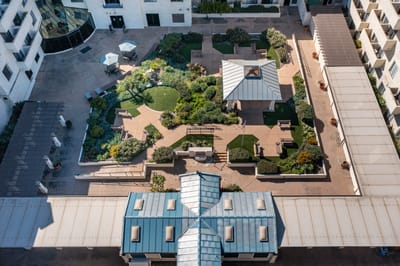 Aerial view of a landscaped courtyard in a senior living facility