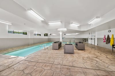 Indoor pool area with seating and swim lanes