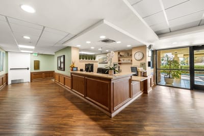 Reception area of a senior living facility with wooden accents
