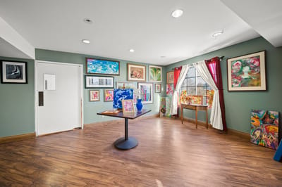 Art-filled common area with comfortable seating