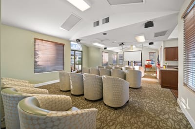 Bright activity room with seating for residents