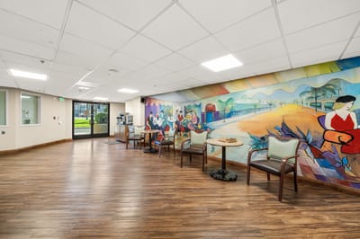 Activity room with mural and seating area