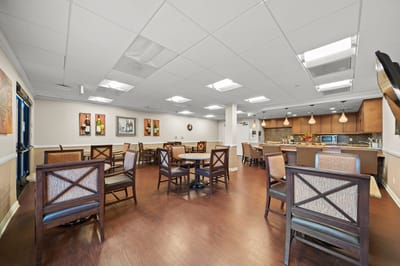 Interior view of a common area with seating and kitchen