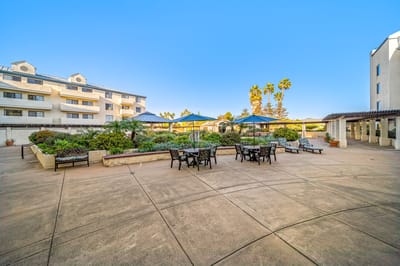 Outdoor courtyard with seating and landscaping