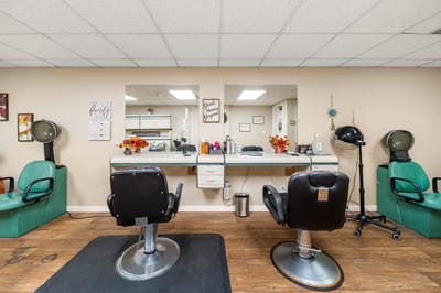 Interior view of a salon area with styling chairs