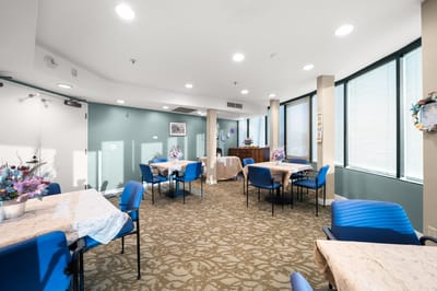Interior view of a common area with tables and chairs