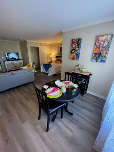 A cozy resident room with dining setup and colorful decor