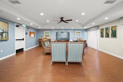 Bright common area with comfortable seating and a television