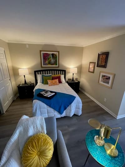 Cozy private resident room with bed and decor