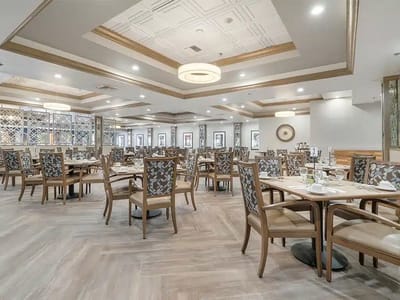 Elegant dining room with tables set for meals