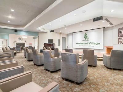 Common area with seating and a presentation screen