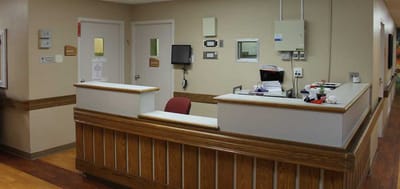 Reception area with a desk and seating