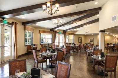 Elegant dining room with tables set for meals