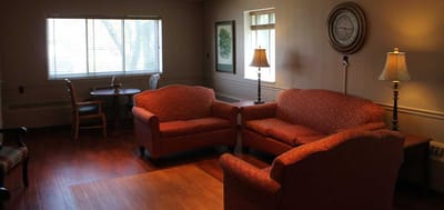 Cozy common area with seating and natural light