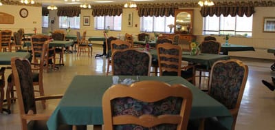 Dining area with tables and chairs in a shared space