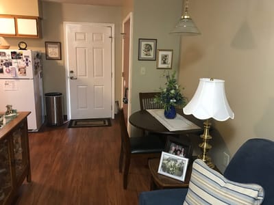 Cozy resident room with kitchen area and dining table