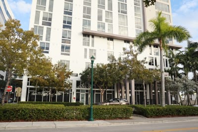 Exterior view of luxury assisted living facility with landscaping