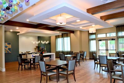 Bright dining area with tables and chairs