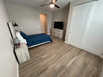 Interior view of a private resident room with a bed and furniture