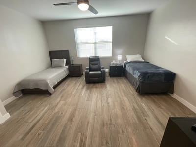 A view of a resident room with two beds