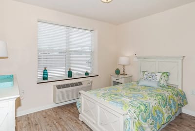 Cozy resident bedroom with a colorful bedspread