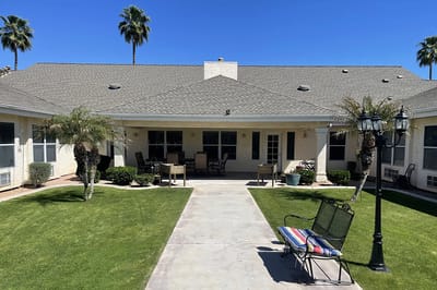 Outdoor space with seating and palm trees