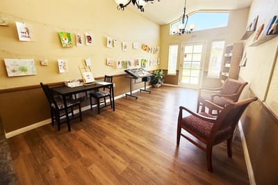 Bright common area with artwork displayed on walls