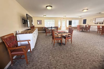 Interior view of a common area with tables and chairs