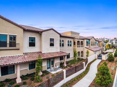 Exterior view of a senior living facility with landscaped gardens