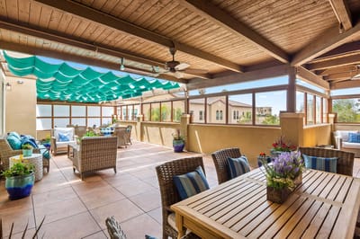 Outdoor patio area with seating and plants