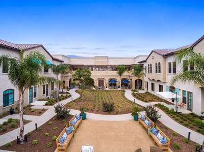 Outdoor courtyard with benches and landscaping