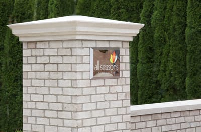 Facility logo on a stone pillar