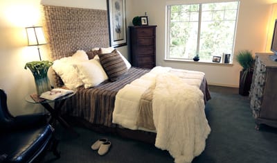 Cozy bedroom interior with a view of a garden