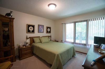 Cozy resident room with a bed and decor