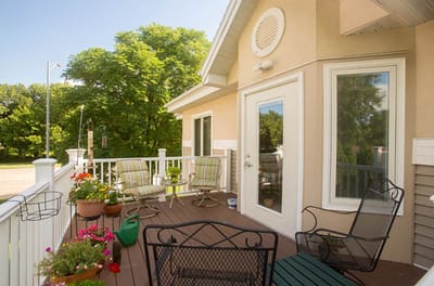 Outdoor seating area with plants and trees