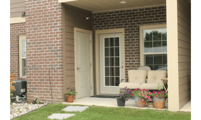 Exterior entrance with seating and flowers