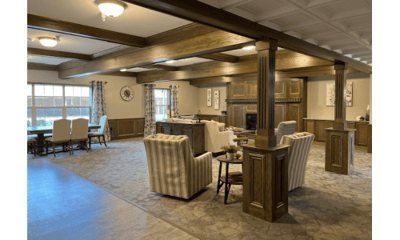 Comfortable common area with chairs and a fireplace