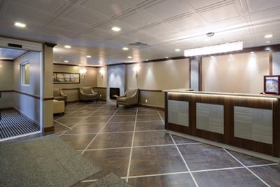 Modern lobby area with seating and reception desk