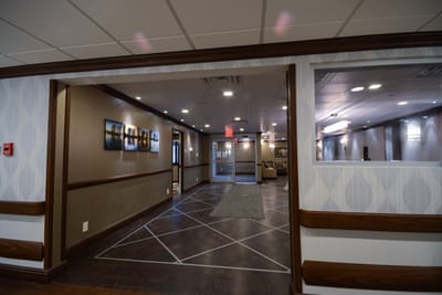 Lobby area of a nursing home with seating and artwork