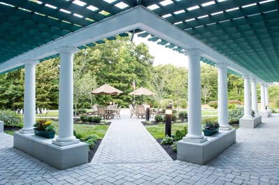 Outdoor seating area with tables and umbrellas