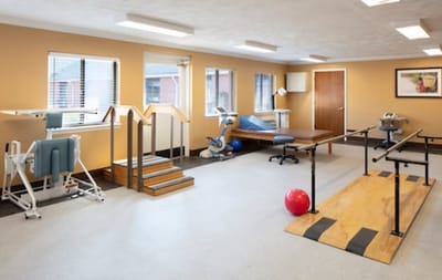 Physical rehabilitation room with therapy equipment