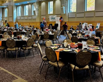 Dining room with tables set for a meal event