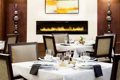 Elegant dining room setup with fireplace