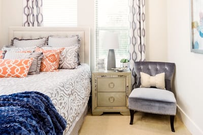 Cozy resident room with a bed and chair