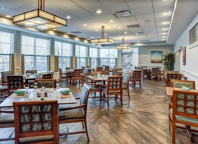 Bright dining room with tables set for meals