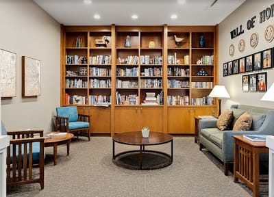 Cozy reading area with bookshelves and seating