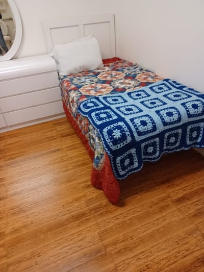 Cozy private resident room with a bed and decor