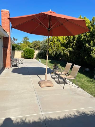 Outdoor seating area with umbrellas and chairs